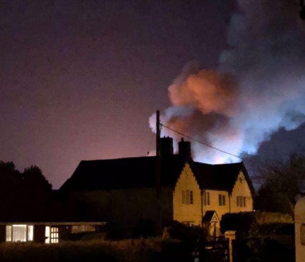 Plumes of thick smoke billowed over nearby streets and homes