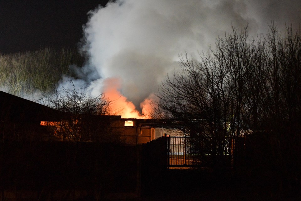 Smoke billows from inside the fire building at the Sir John Peel Hospital in Tamworth