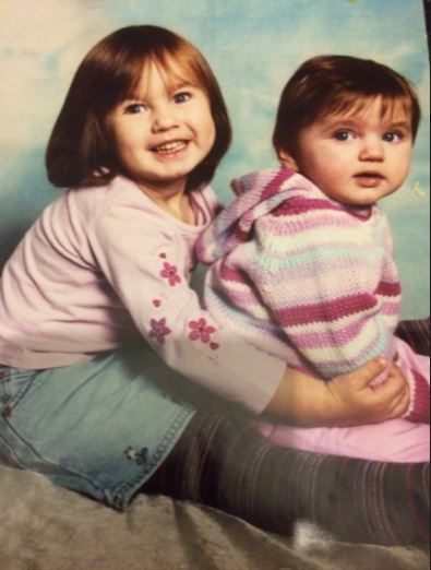  Johdi, in striped top, with her big sister