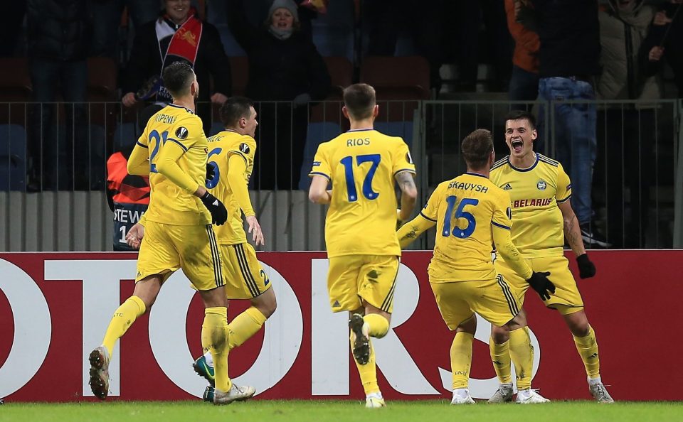  BATE players mob Stanislav Dragun after his stunning breakthrough goal