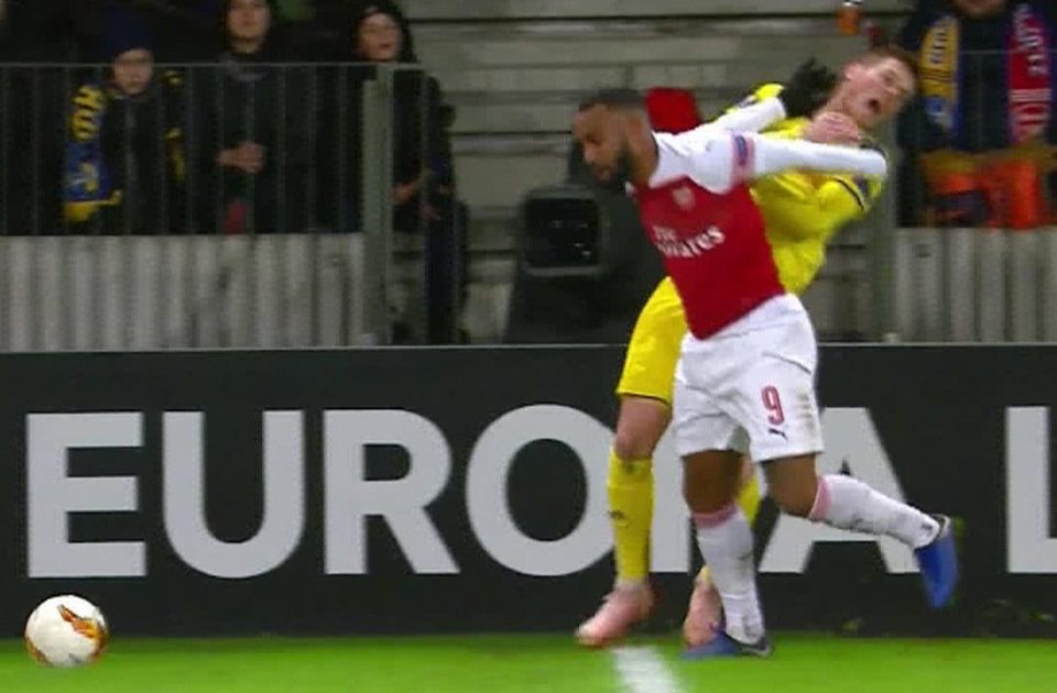  Alexandre Lacazette was given a straight red card for this elbow after he was held round the chest