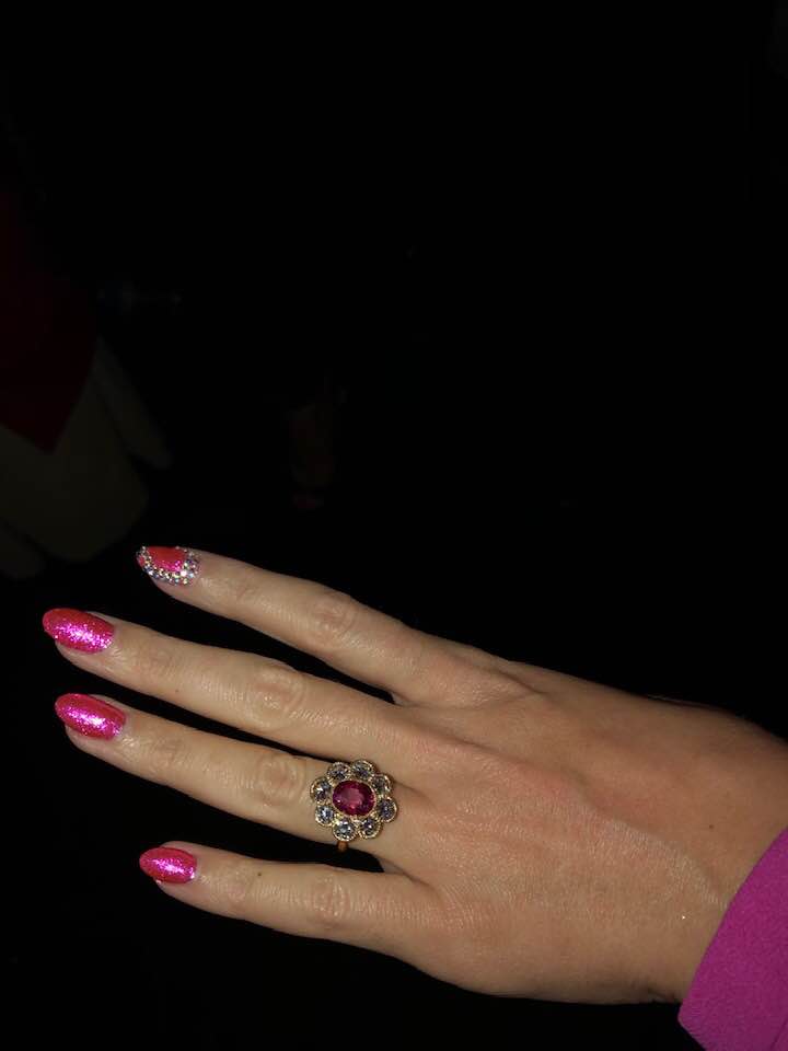  Katy's ring features a ruby and diamonds in a floral design