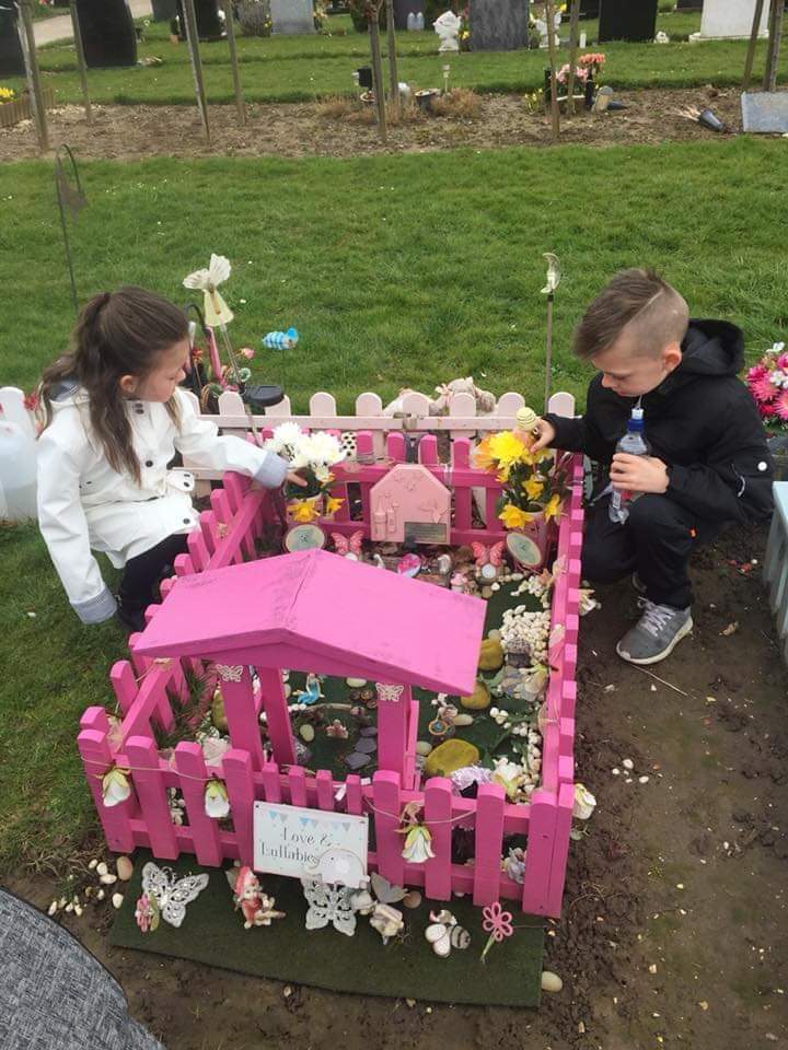  Kelly Desborough and Tony Wilson, both 34, have been told to remove the decorations they placed on their stillborn daughter Ebonie's grave. Pictured is the couple's older children at Eastern Cemetery, Hull