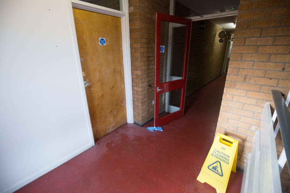  An image shows the corridor outside the Yamba family flat where racist graffiti was scrawled