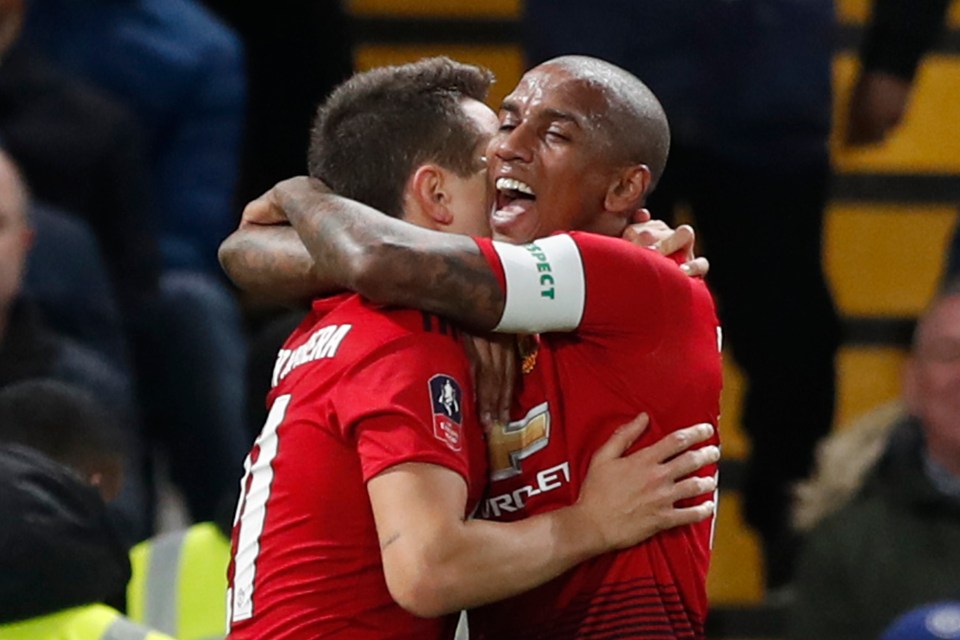  Ashley Young (right) embracing Ander Herrera, who opened the scoring for Man Utd