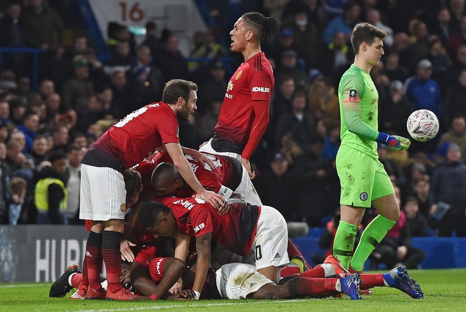  The jubilant Manchester United players celebrate Pogba's goal