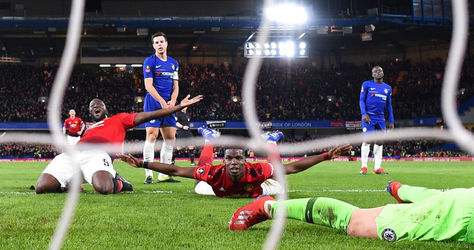  Paul Pogba celebrates on the turf to double Manchester United's advantage