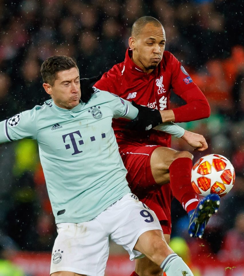  Fabinho gets to grips with Bayern's striking legend Robert Lewandowski but it was still experienced Jordan Henderson who was the key influence for the Reds