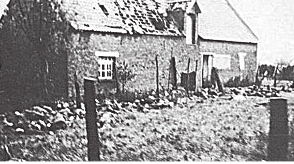  Bodies of the murdered soldiers of the Royal Norfolk Regiment, still lying next to the barn where they had been shot