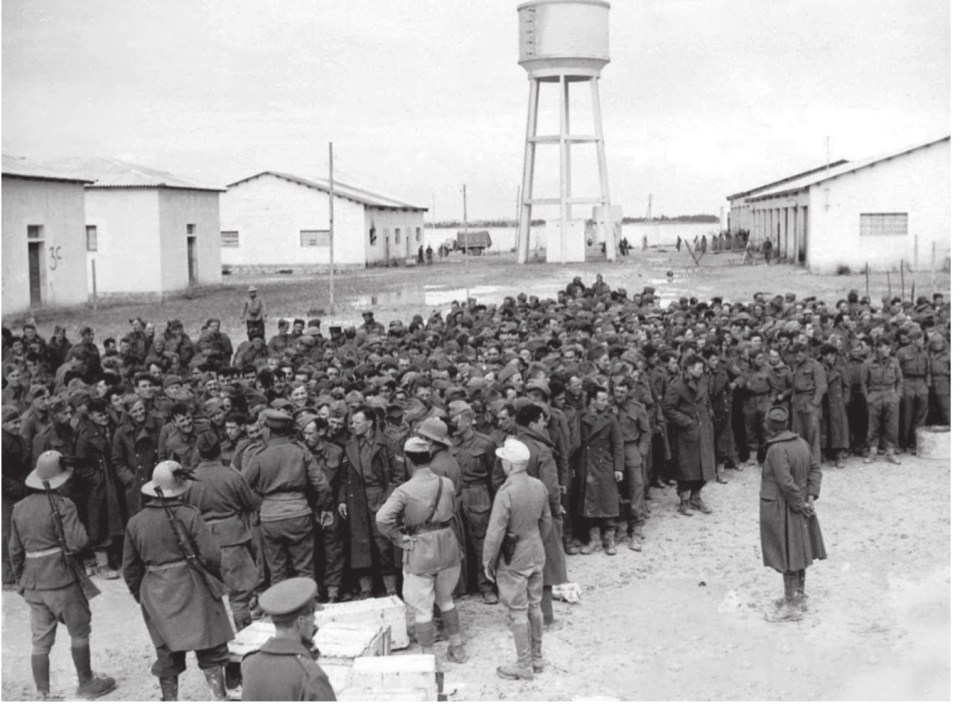  Captured British soldiers and airmen assemble at an Italian prisoner-of-war camp in December 1941