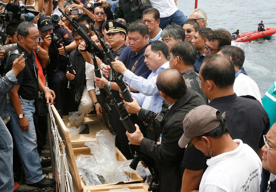  Customs and Coastguard officials seized a boat full of high-power weapons at a port in Manila - where Paul operated from