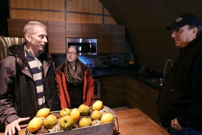  Community members Michael and Megan Gembala, left, talk with Vivos owner Robert Vicino inside their bunker