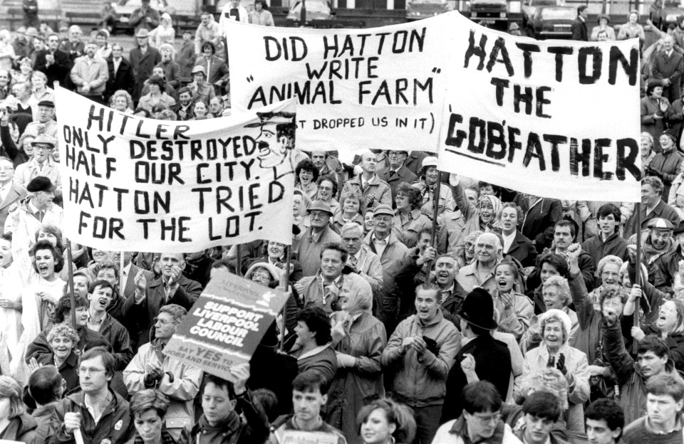  A crowd furious with Derek Hatton in 1986, the year he was booted out of Labour, with banner reading: 'Hitler only destroyed half our city. Hatton tried for the lot'