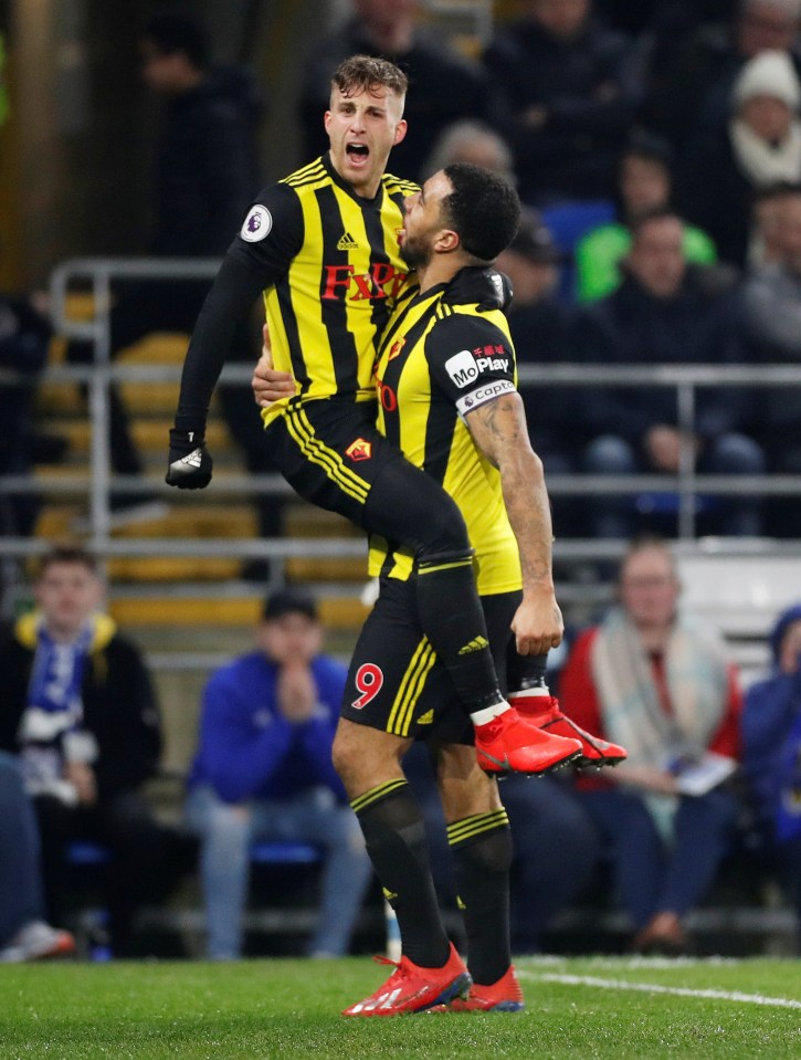 Goalscorers Deulofeu and Deeney celebrate together at the Cardiff City Stadium