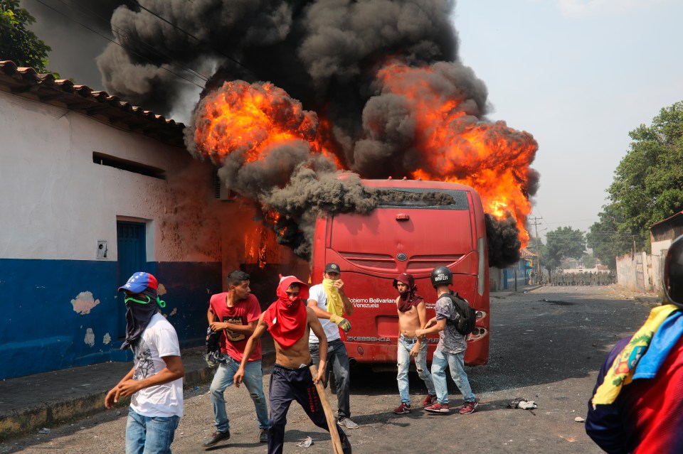  A bus set alight in the middle of clashes with the Venezuelan soldiers