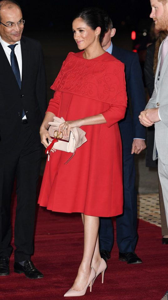  Meghan looked elegant in a bright red dress