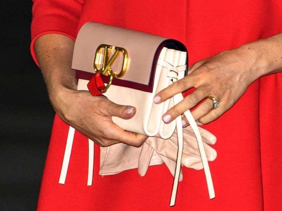  Meghan accessorised her red Valentino dress with a pink clutch bag and matching gloves