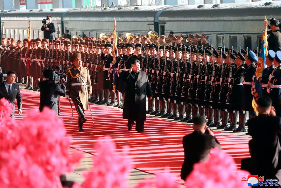  Kim salutes North Korean soldiers during a lavish sending-off ceremony