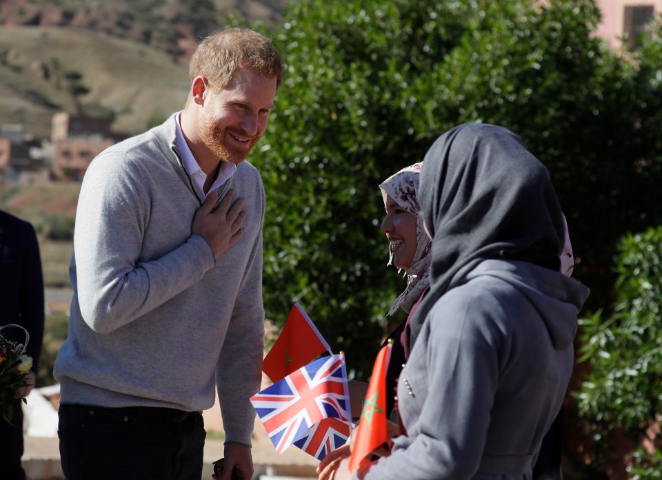  Prince Harry touches his heart with his hand in a respectful greeting according to local custom