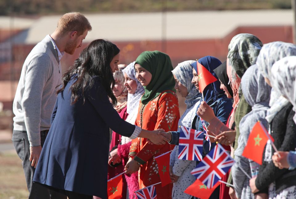  Teenage girls with Union Jacks greeted them in the remote village