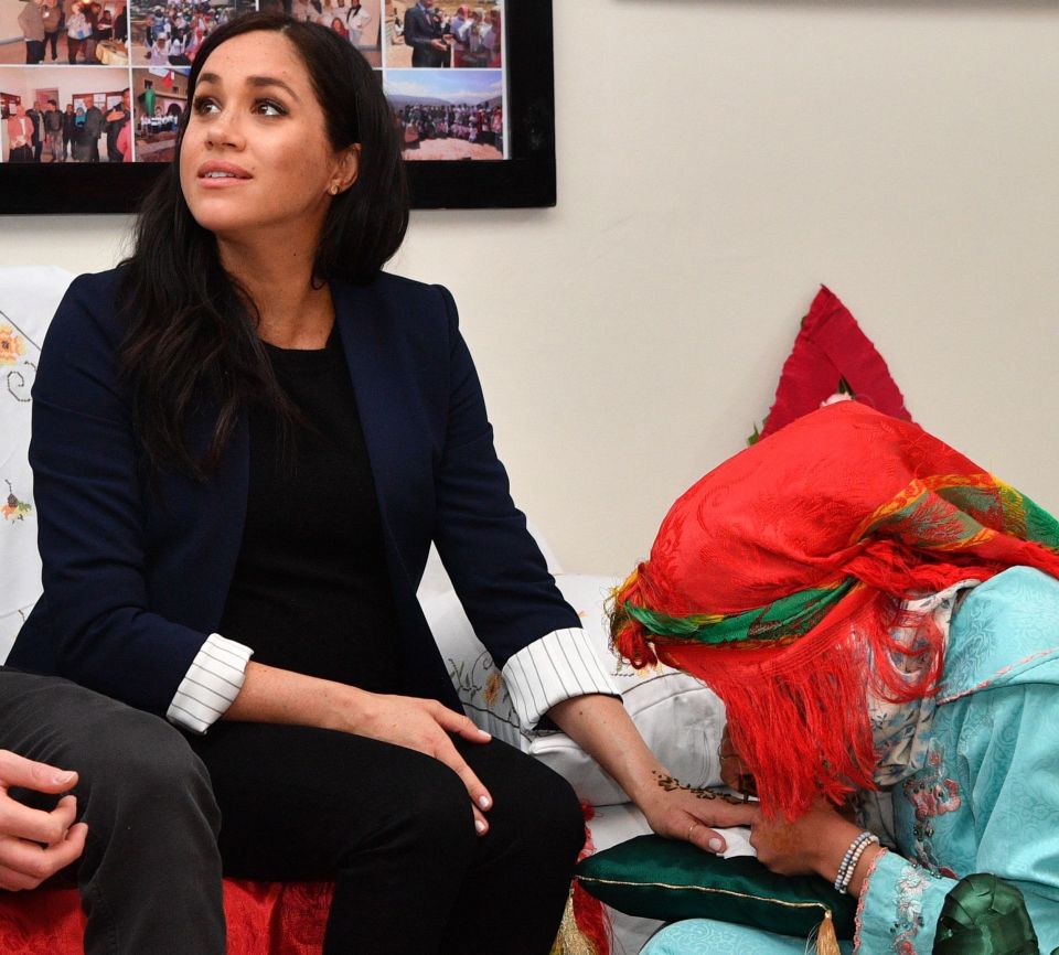  Pupil Samira, 17, gives Meghan the henna tattoo, said to be a good luck symbol