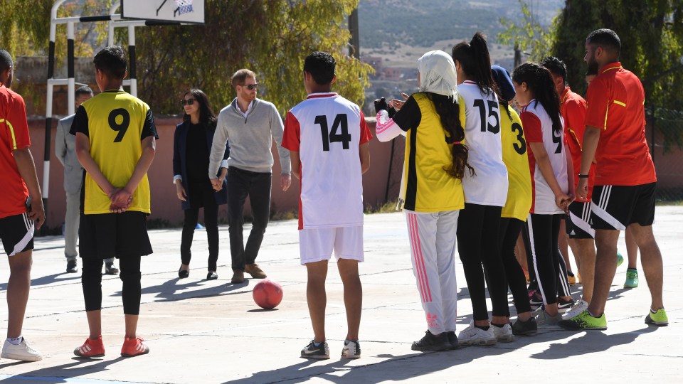  Harry joined in with the youngsters and showed off his footy skills