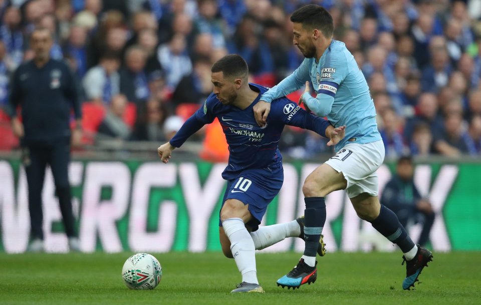  David Silva gets to grips with Chelsea's main dangerman Eden Hazard