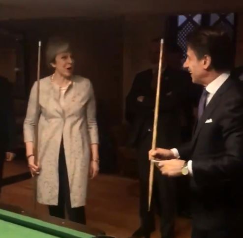  Mrs May giggled as the pair prepared for a game of pool