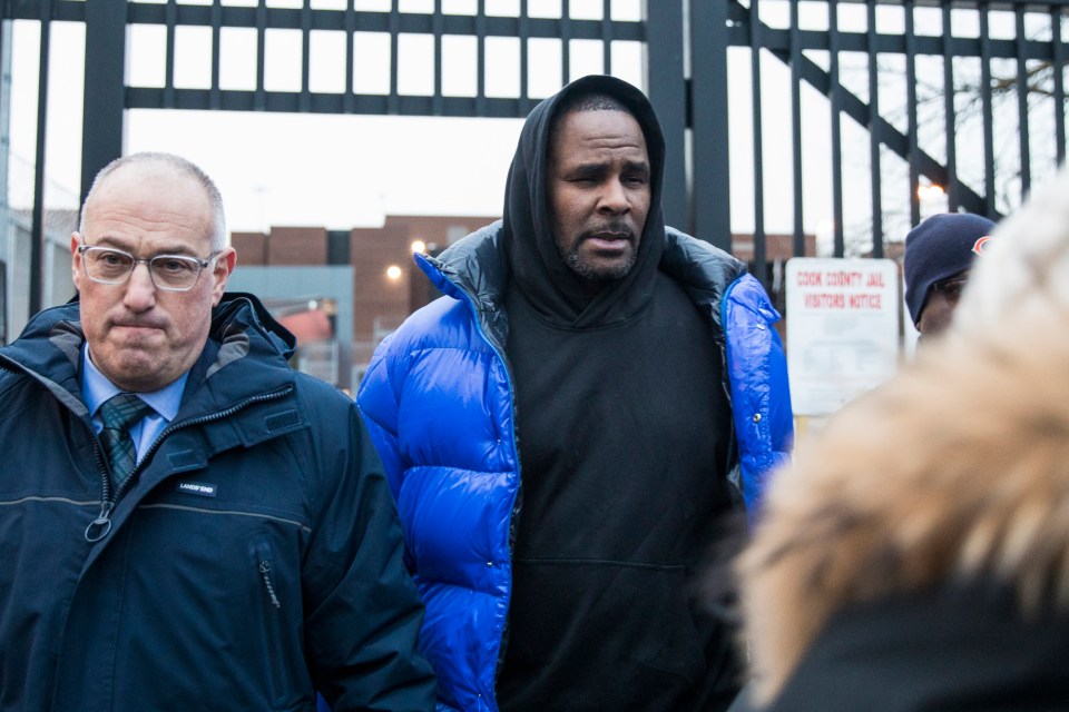 R Kelly was released from jail today, pictured with his lawyer