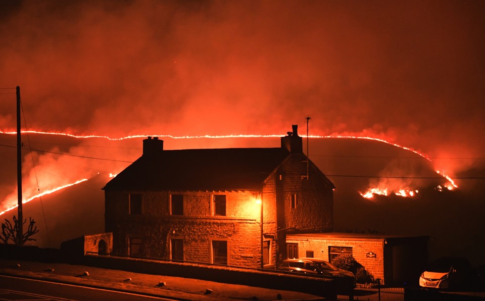 The flames are just yards from homes in Saddleworth Moor