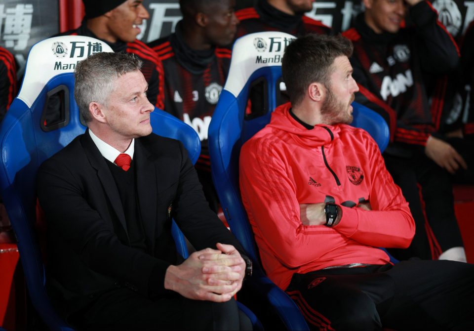  Ole Gunnar Solskjaer and assistant coach Michael Carrick look on in the 3-1 win