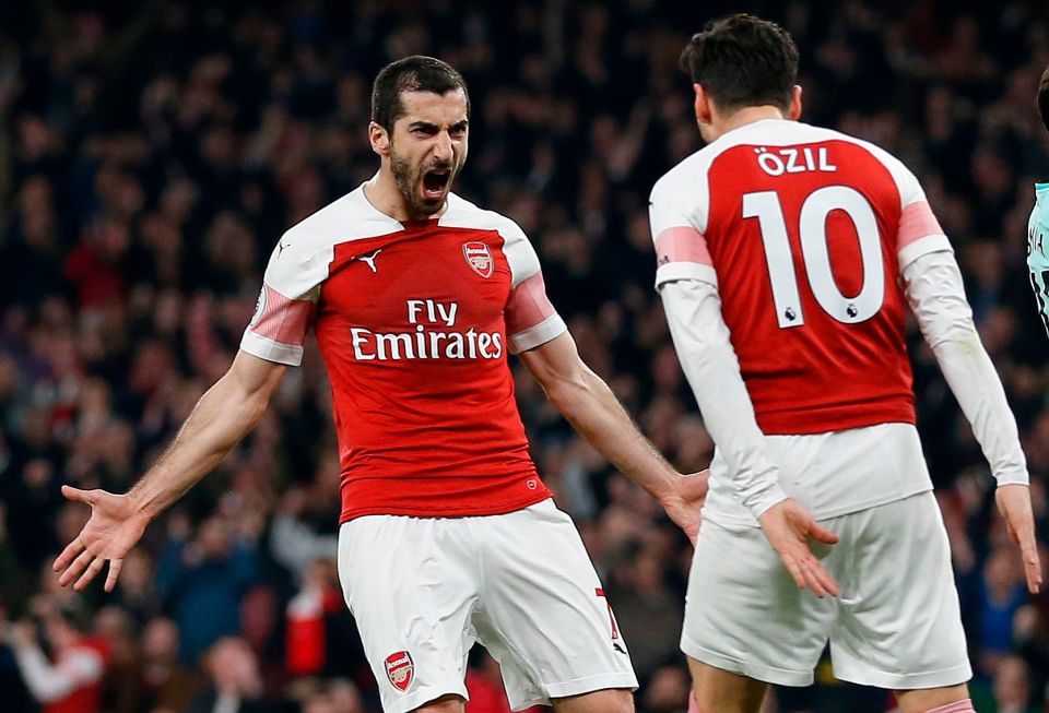  Mkhitaryan reacts with Ozil after getting on the score sheet for the second game running