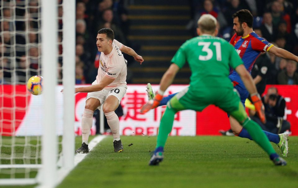  Man Utd's young Portuguese full-back Diogo Dalot fails to stop the ball going out as keeper Vicente Guaita looks on