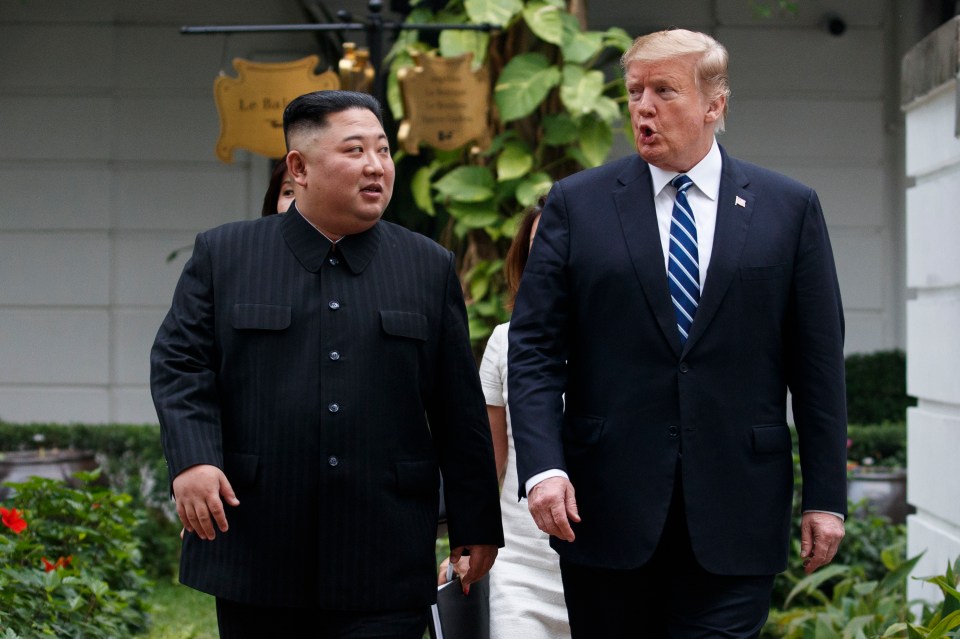  Trump and Kim Jong Un take a walk after their first meeting at the Vietnam summit