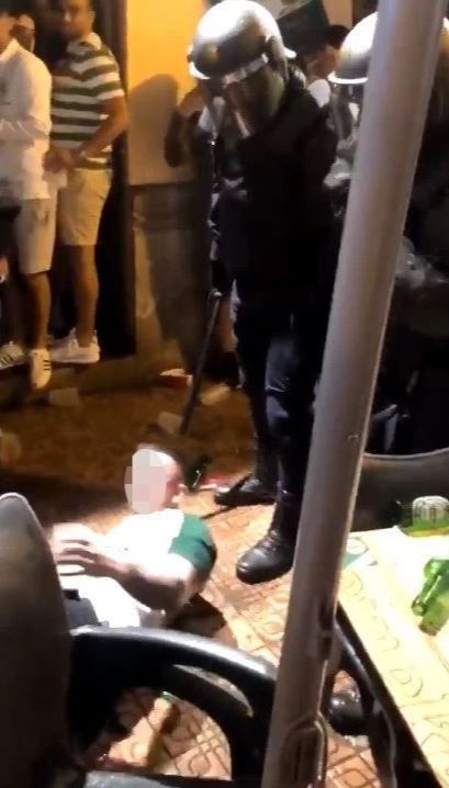  A man lies on the floor after he battled against the cops