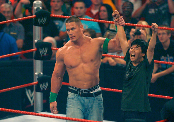  John Cena poses with Ken Jeong during the actor's appearance on Raw in 2009