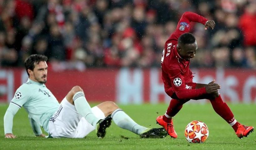  Bayern Munich defender Mats Hummels slides in on Liverpool midfielder Naby Keita during the 0-0 Champions League last-16 first-leg draw