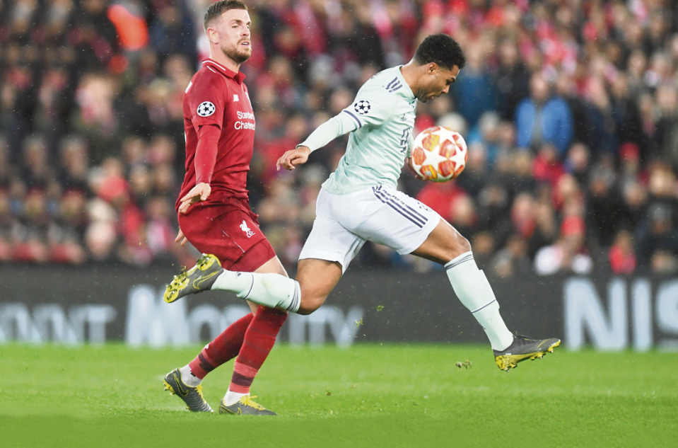  Liverpool midfielder Jordan Henderson, seen tussling with Bayern Munich striker Serge Gnabry, was an inspirational battler and leader on the big stage at Anfield