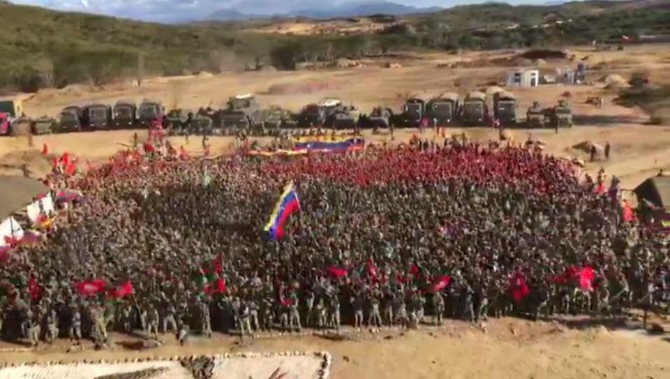  Hundreds of Venezuelan troops gather to cheer as President Maduro watches on