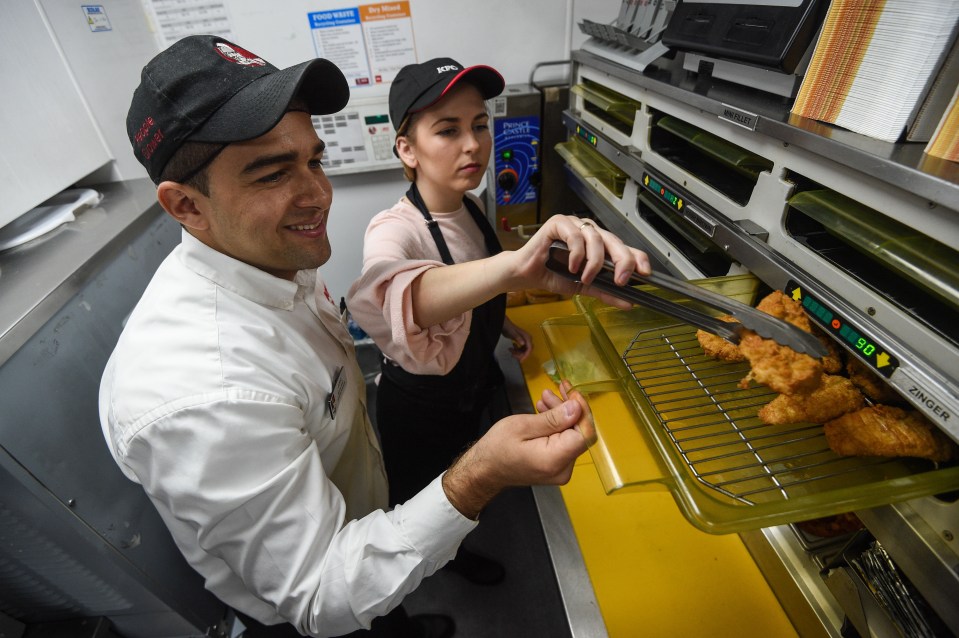  Customers can try their hands at frying and grilling chicken in KFC kitchens