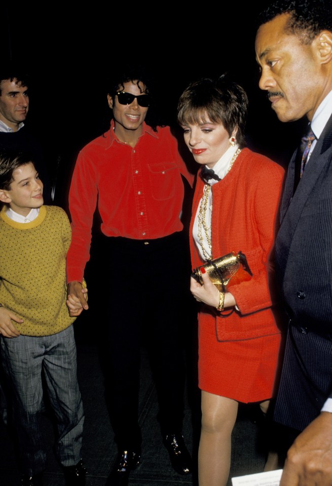  Michael holds Jimmy's hand at a 1988 Phantom of the Opera performance with Liza Minnelli