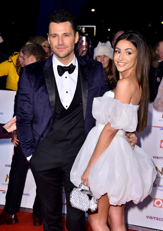  Michelle poses with husband Mark at the National Television Awards