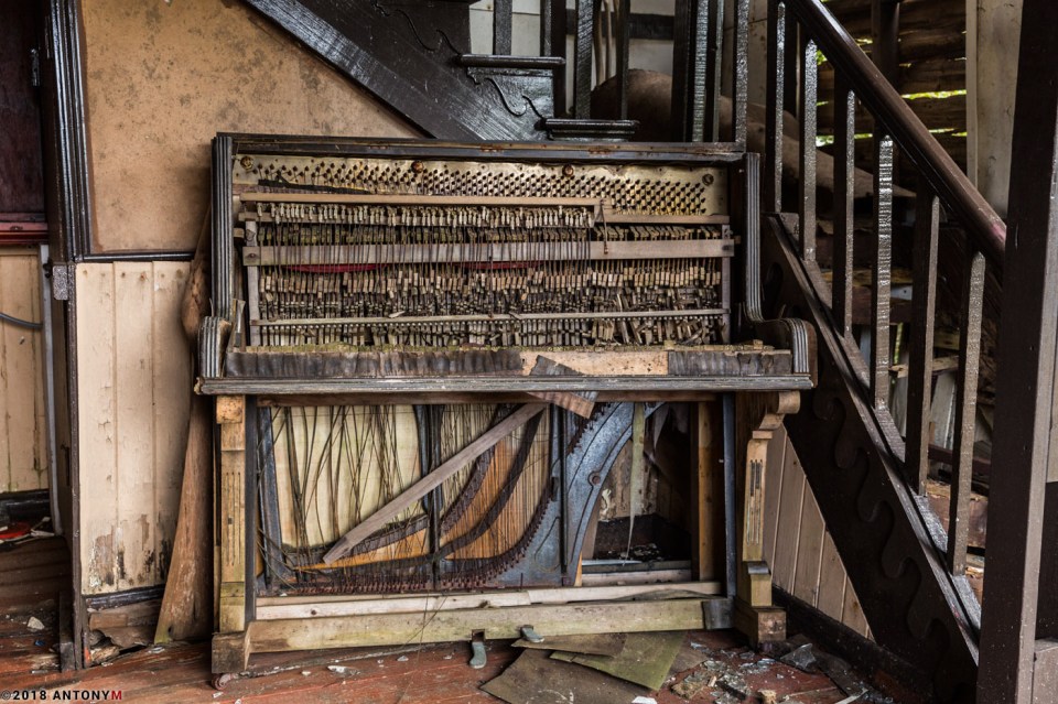 The outer layer of this other broken piano has been destroyed as the keys have been ripped off