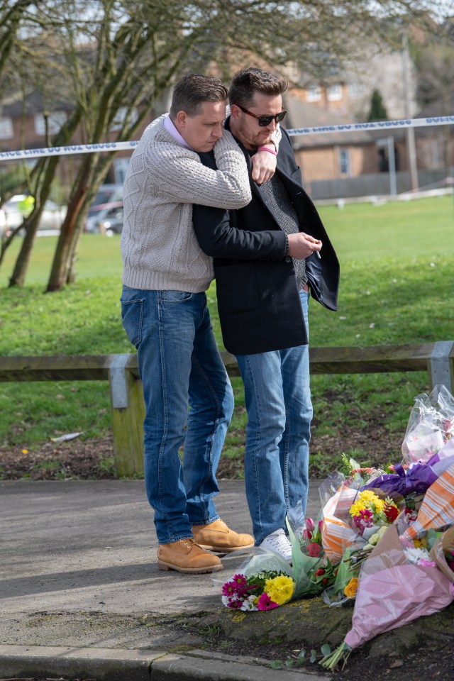 Jodie’s dad Peter Chesney, right, is consoled at the park where his daughter was killed