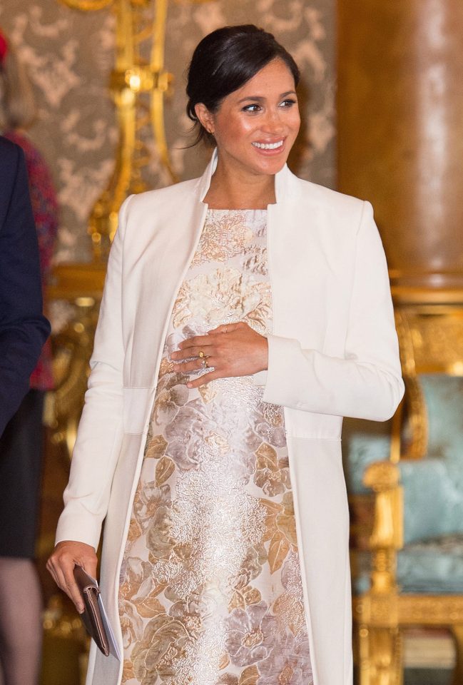  Meghan wore a white coat by Amanda Wakeley and a cream and gold jacquard brocade dress, with her coat alone costing nearly £1,000