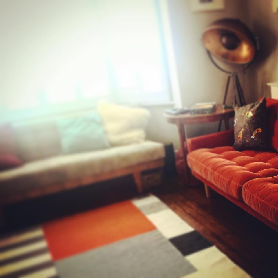  She has posted pictures of her stunningly sleek home, writing: 'Totally in love 🧡🧡🧡with our new orange sofa'