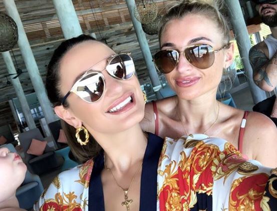  The sisters looked stunning as they relaxed in the luxury resort