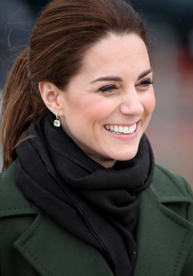  The Duchess of Cambridge grins as she speaks to locals