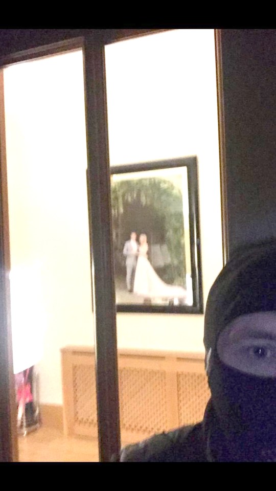  The selfie taken by a burglar outside Brendan Rodgers' Glasgow home with his wedding picture in the background