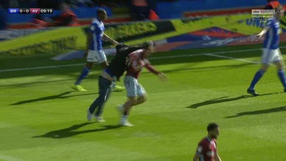  This was the shocking moment a Birmingham fan ran onto the pitch and went for Jack Grealish